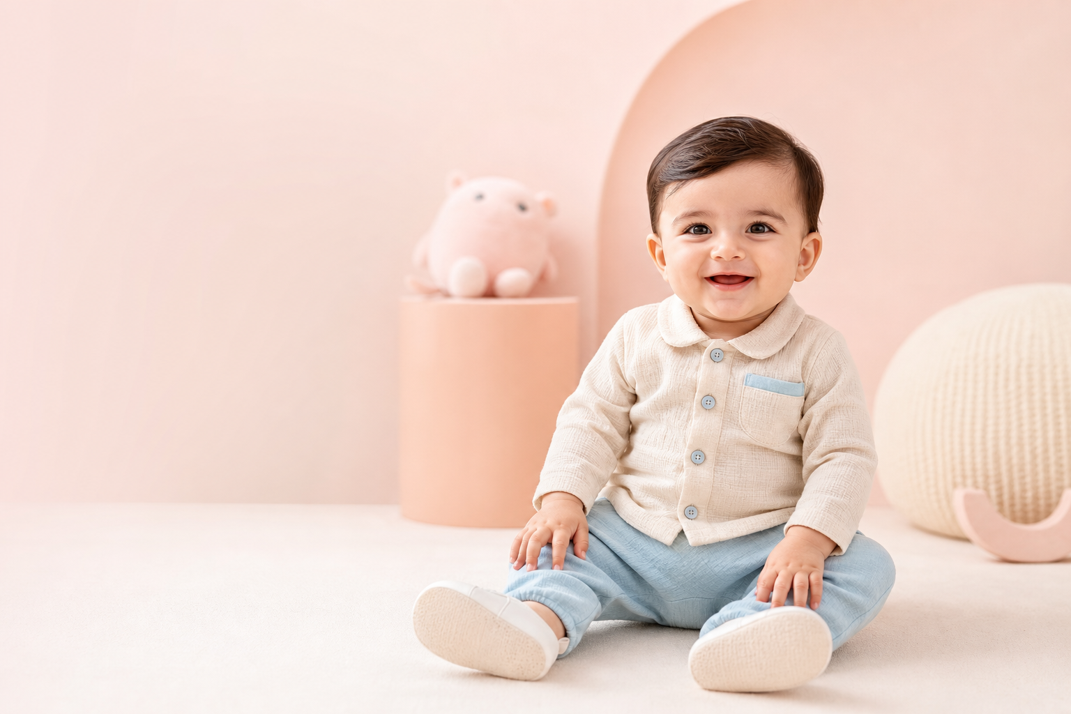 Smiling baby wearing a premium pastel Salty Pumpkin outfit